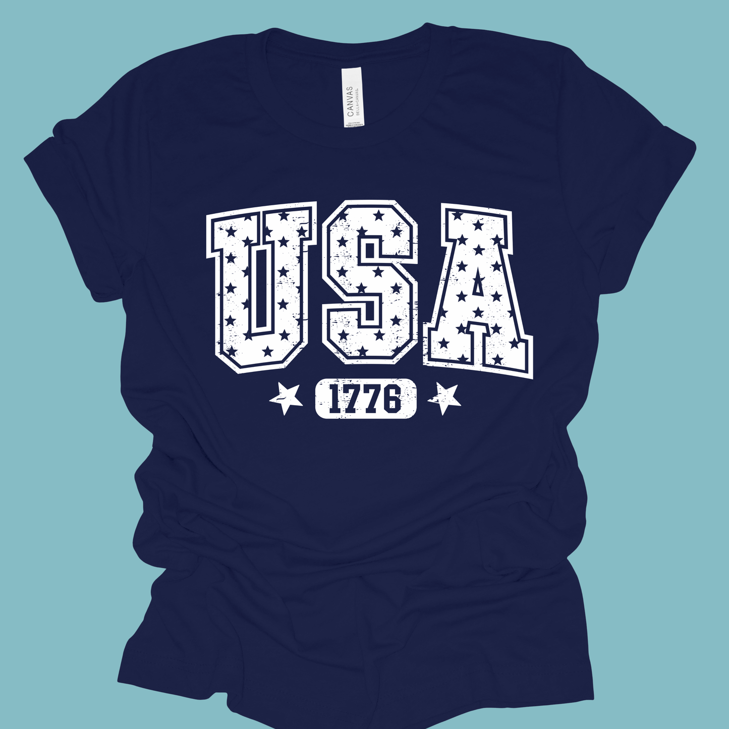 Navy blue t-shirt with 'USA 1776' text on a light blue background